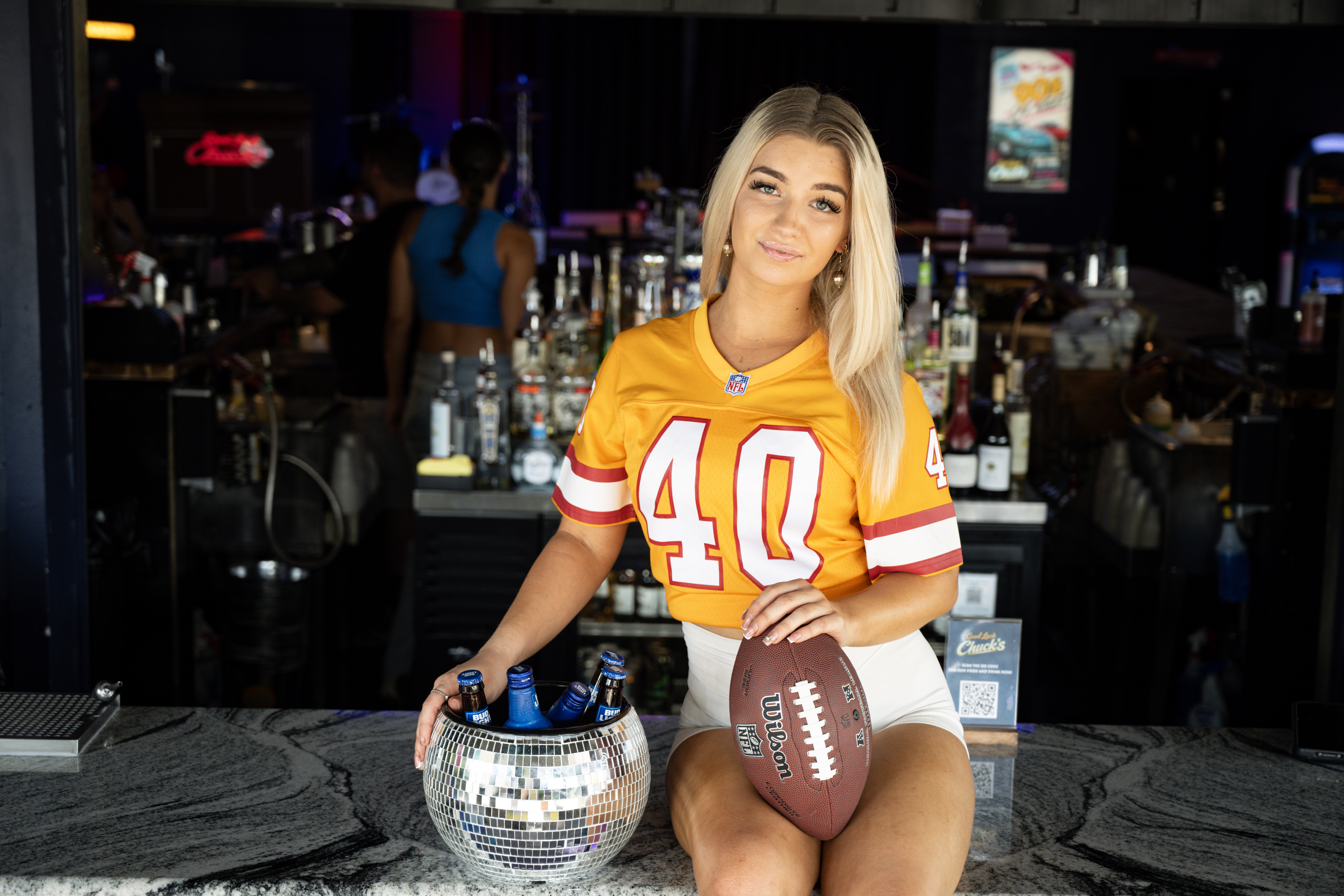 picture of a blonde girl promoting football
